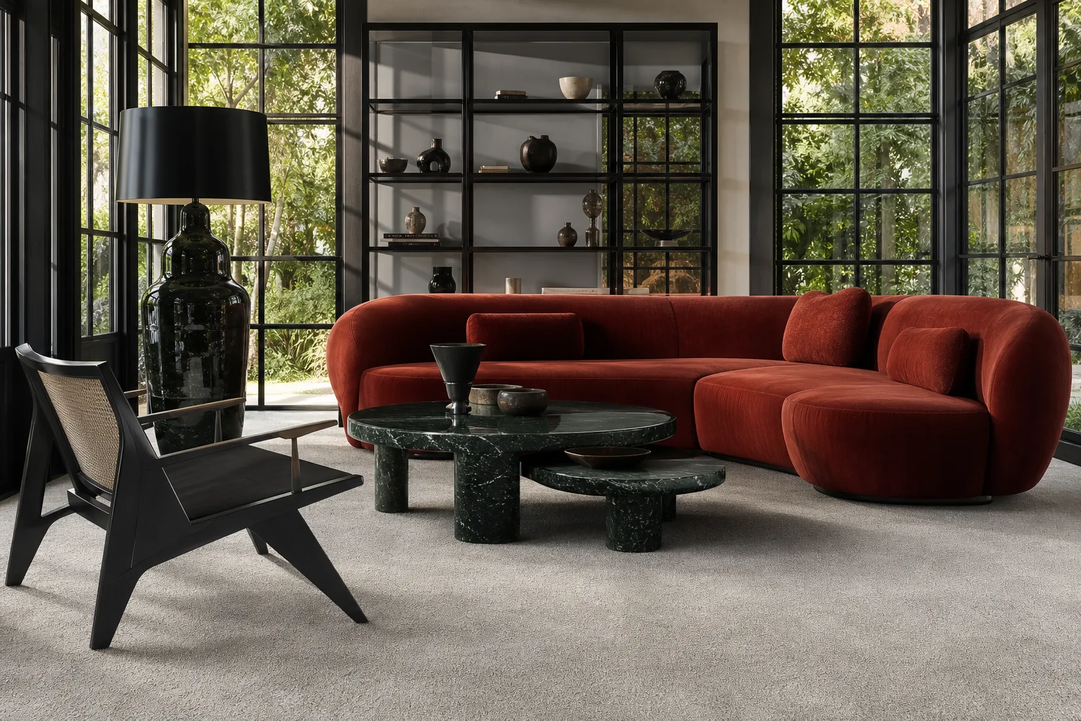 A MAJLIS oyster rug in a living room with red seating and black framed windows.